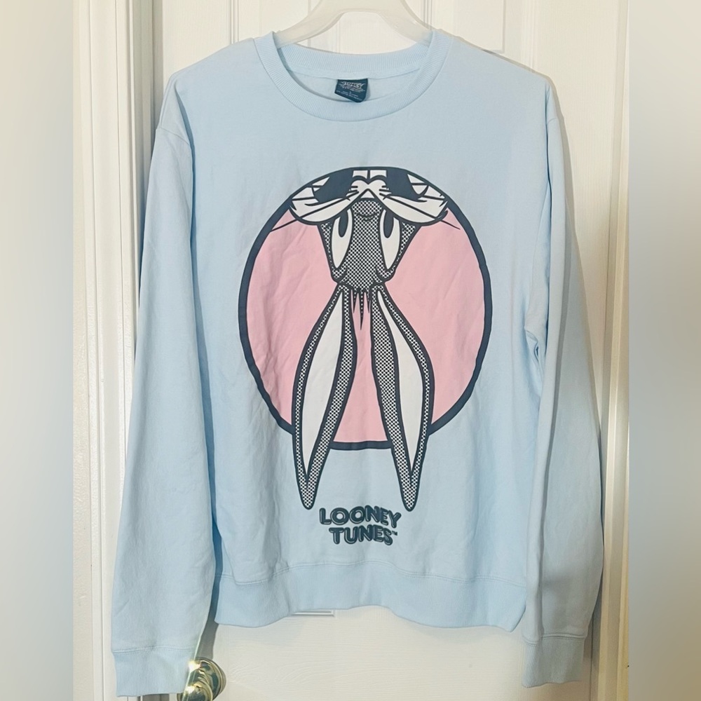 Looney tunes sweater- new with tags . Large and Medium